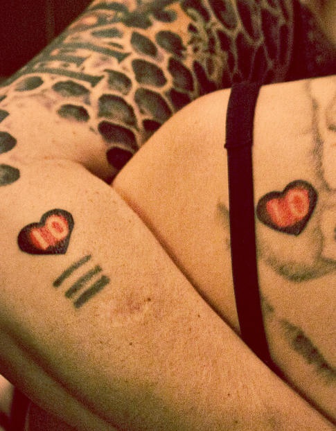 Matching hearts lovers tattoos