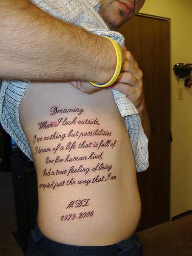 Large memorial writings tattoo on side
