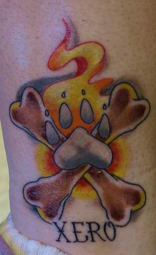 Xero dog paw with crossed bones memorial tattoo