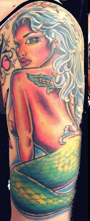 Colourful tanned mermaid tattoo