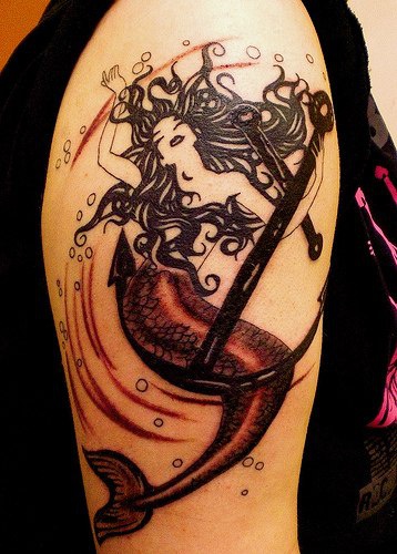 Black mermaid with anchor tattoo