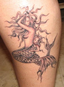 Two mermaids black ink tattoo