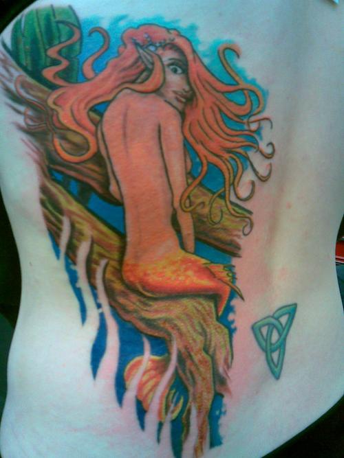 Celtic style mermaid on branch tattoo
