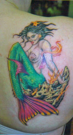 Brunette mermaid coloured tattoo