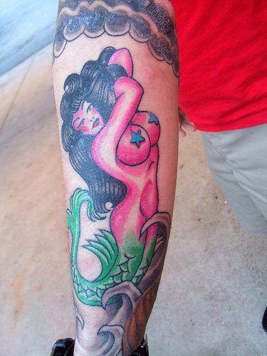 Huge brest mermaid pin up style tattoo