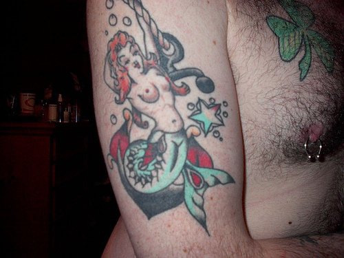 Naked pin up style mermaid tattoo