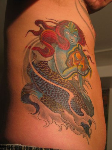 Blue mermaid with golden mask  tattoo