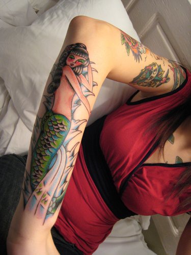 Classic style mermaid tattoo on arm