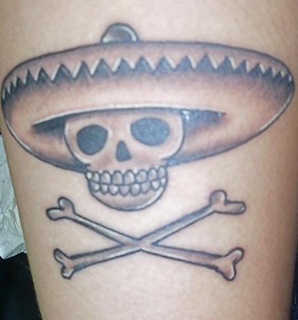 Skull and crosed bones in sombrero tattoo