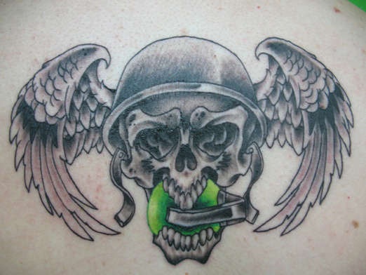 Winged skull with granade in mouth tattoo