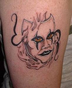 Creepy mask with real eyes and lips tattoo