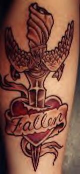 Heart stubbed with winged knife tattoo