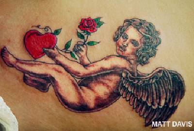 Detailed cherub with heart and rose tattoo