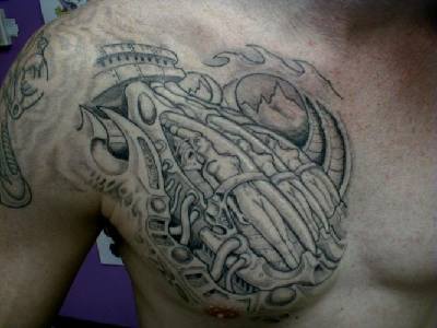 Detailed biomechanical chest tattoo