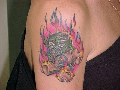 Old teddy bear in flame tattoo