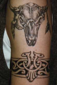 Bull skull and tribal armband tattoo
