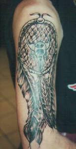 Large dreamcatcher tattoo on arm