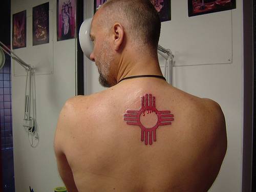 Tribal indian symbol tattoo on back