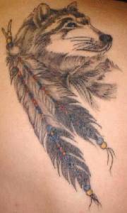 Indian wolf with feathers tattoo