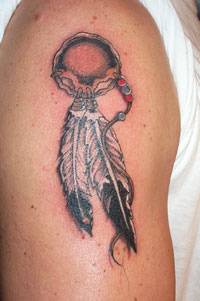 Indian talisman with feathers tattoo on shoulder