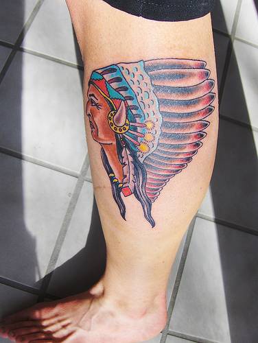Coloured indian chief in feathers tattoo