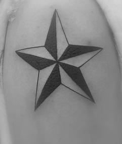 Black and white pentagram tattoo