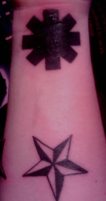 Two different stars tattoo on wrist