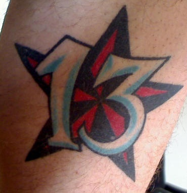 Lucky number thirteen in star tattoo
