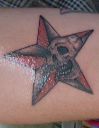 Red and black star with skull tattoo