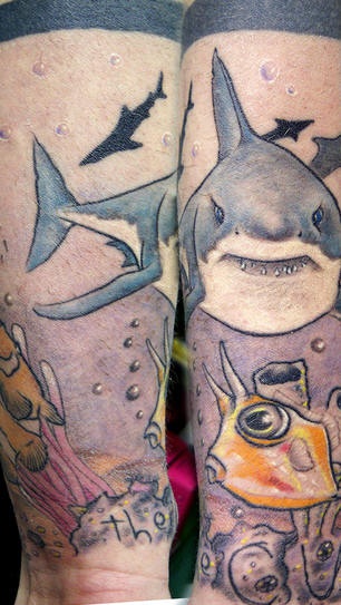 Ocean theme arm sleeve tattoo