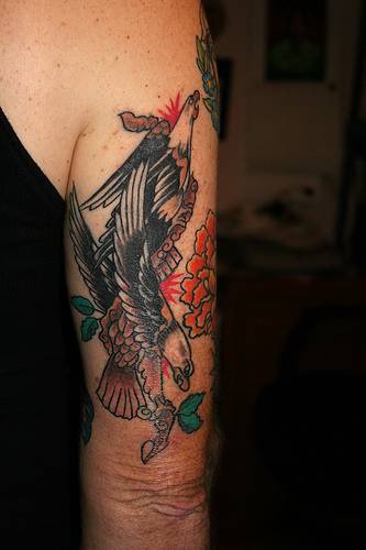 Traditional colored tattoo with two black eagles