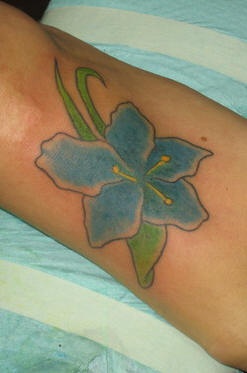 Blue orchid flower tattoo