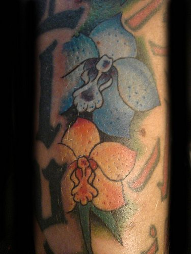 Orchid flowers part of tattoo