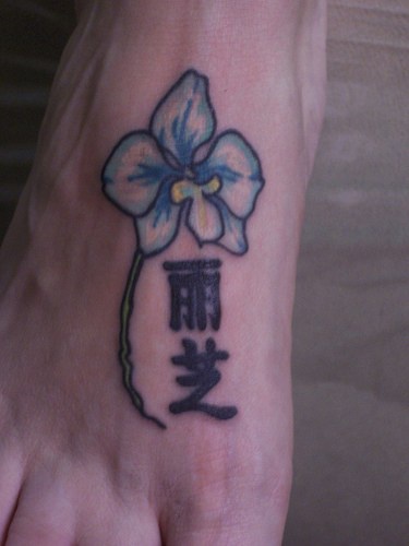 Orchid flower and hieroglyphs tattoo