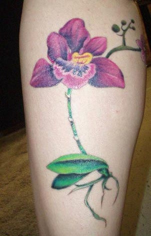 Realistic orchid flower tattoo in colour