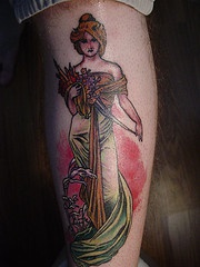 Traditional colored tattoo of beautiful greek lady with flowers