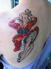 Traditional black tattoo with marilyn monroe in red dress
