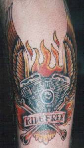 Ride free in flames biker tattoo