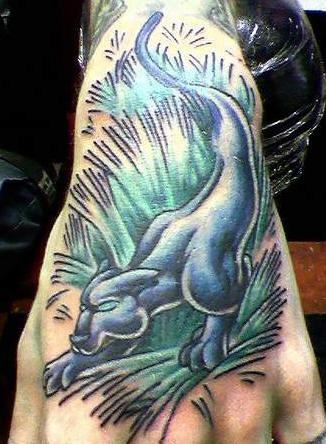 Panther in field tattoo on hand