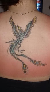 Colourful magic phoenix tattoo