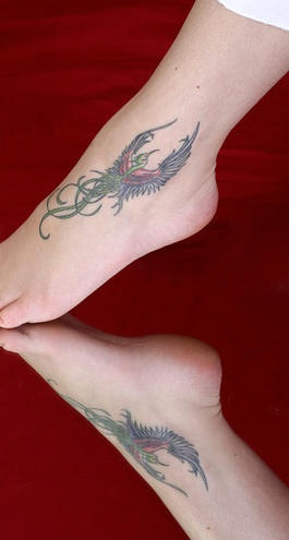 Magic birds tattoos on both legs