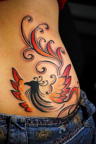 Minimalistic coloured phoenix tattoo