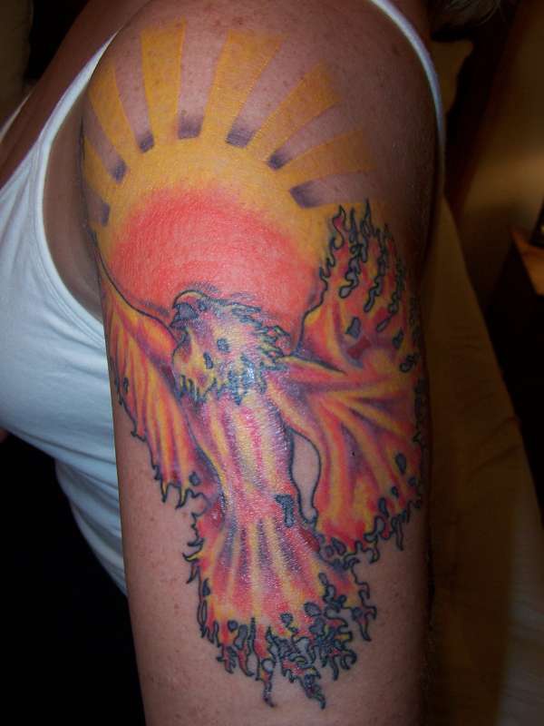 Phoenix and sun tattoo on shoulder