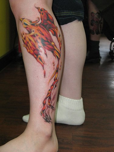 Detailed phoenix tattoo on leg