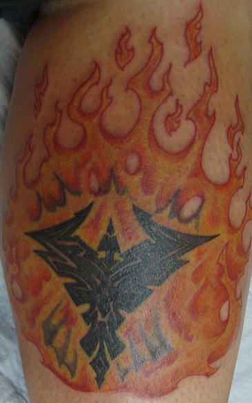 Phoenix symbol in fire tattoo