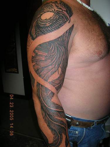 Highly detailed phoenix black ink tattoo