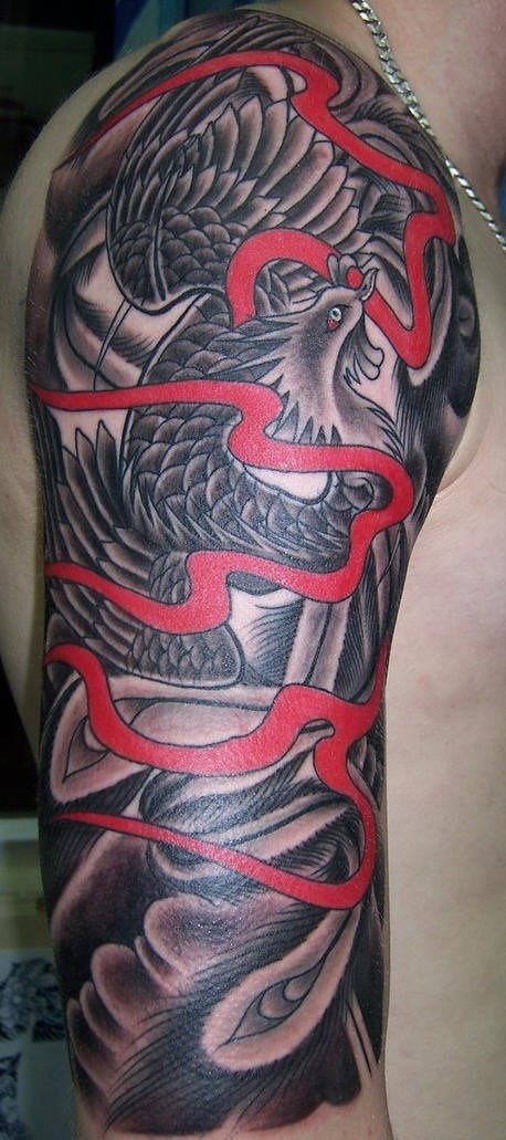 Shoulder tattoo,big,black monster,red stripe