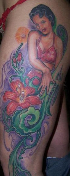 Pinup girl and flower tracery tattoo