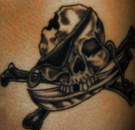 Broken pirate skull and crossed swords tattoo