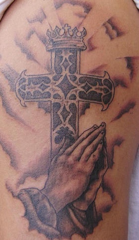 Praying hands and cross detailed tattoo